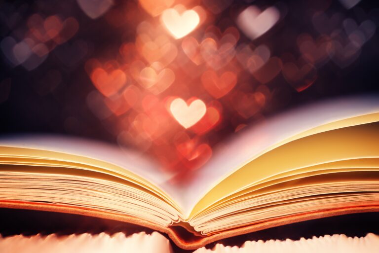 An open book adorned with hearts