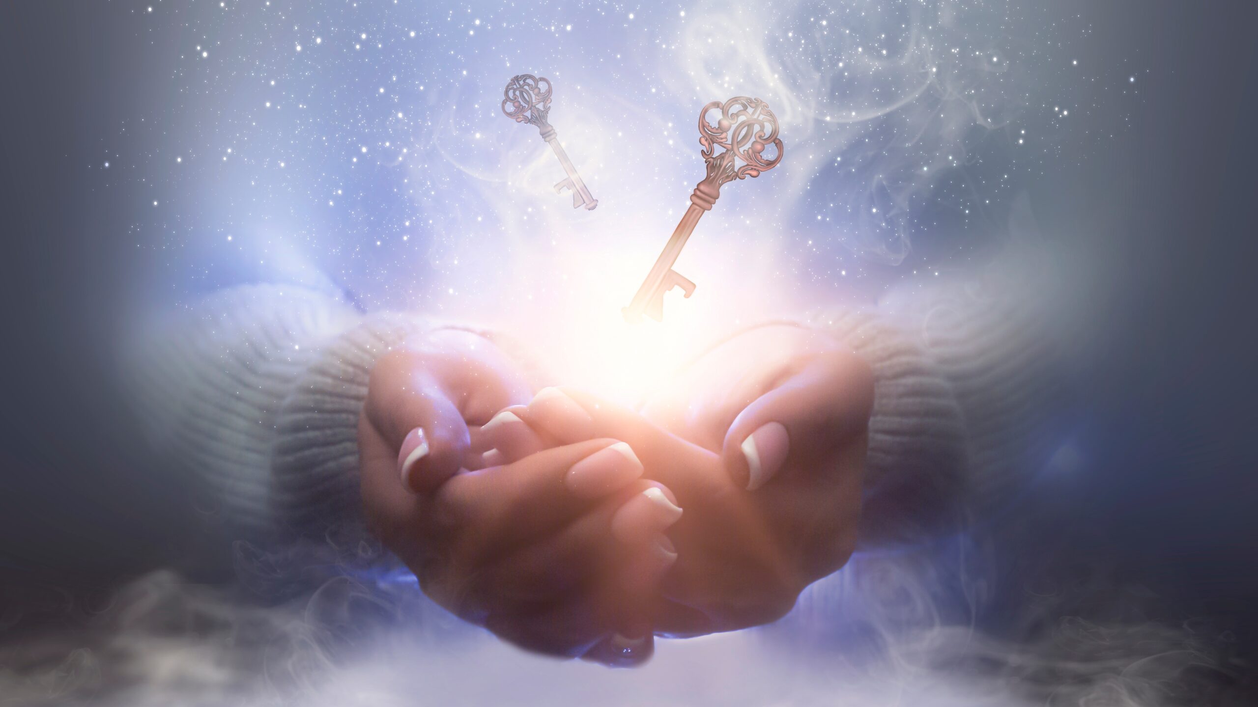 A person holding two keys in their hands